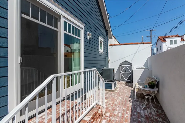 a view of a chair and table in the balcony