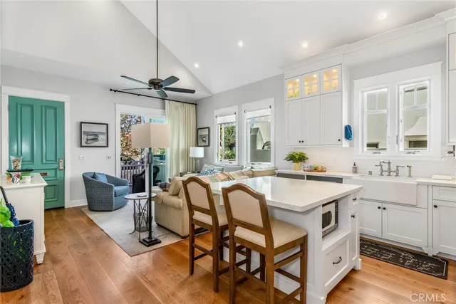 a view of a dining room with furniture and a chandelier