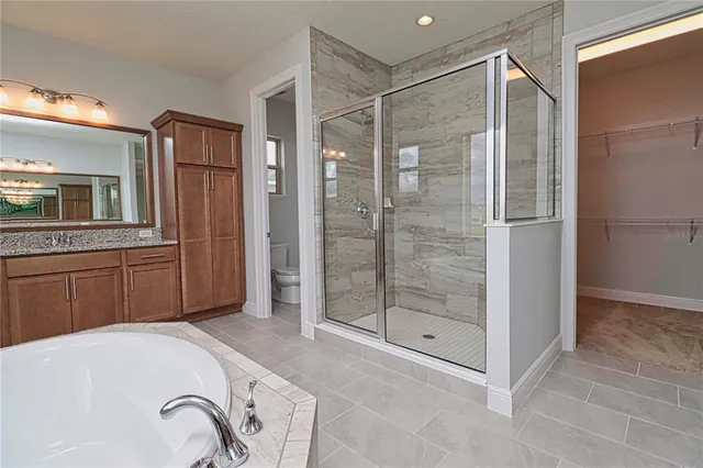 a bathroom with a sink vanity and a mirror
