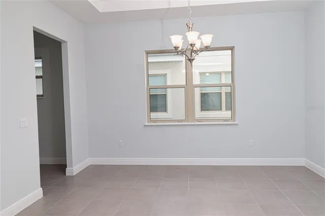 an empty room with a chandelier