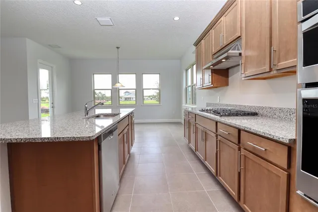 a view of a hallway with a wooden floor