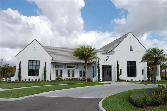 a living room with fireplace furniture and a chandelier