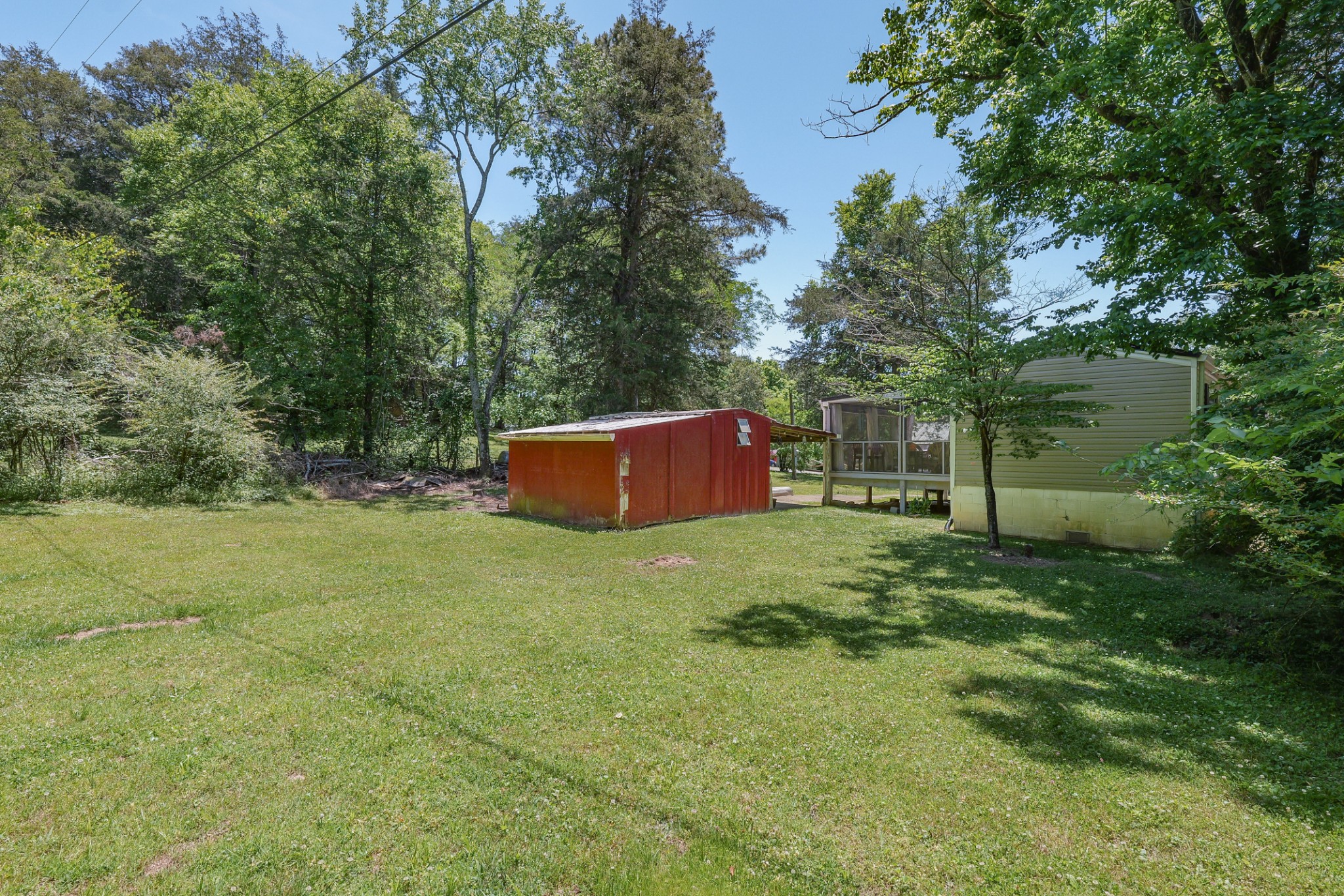 21 Lincoln Lake Road Kelso, TN 37348 - Photo 7 of 26 a backyard of a house with lots of green space and fountain
