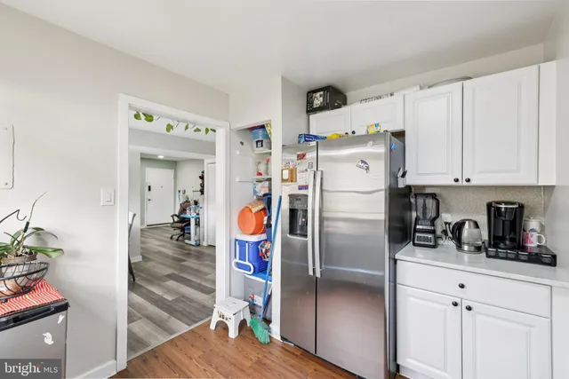 a kitchen with stainless steel appliances cabinets and a counter top space