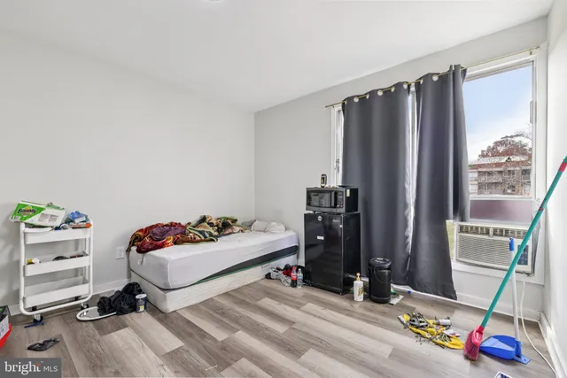a kitchen with stainless steel appliances a refrigerator a sink and cabinets
