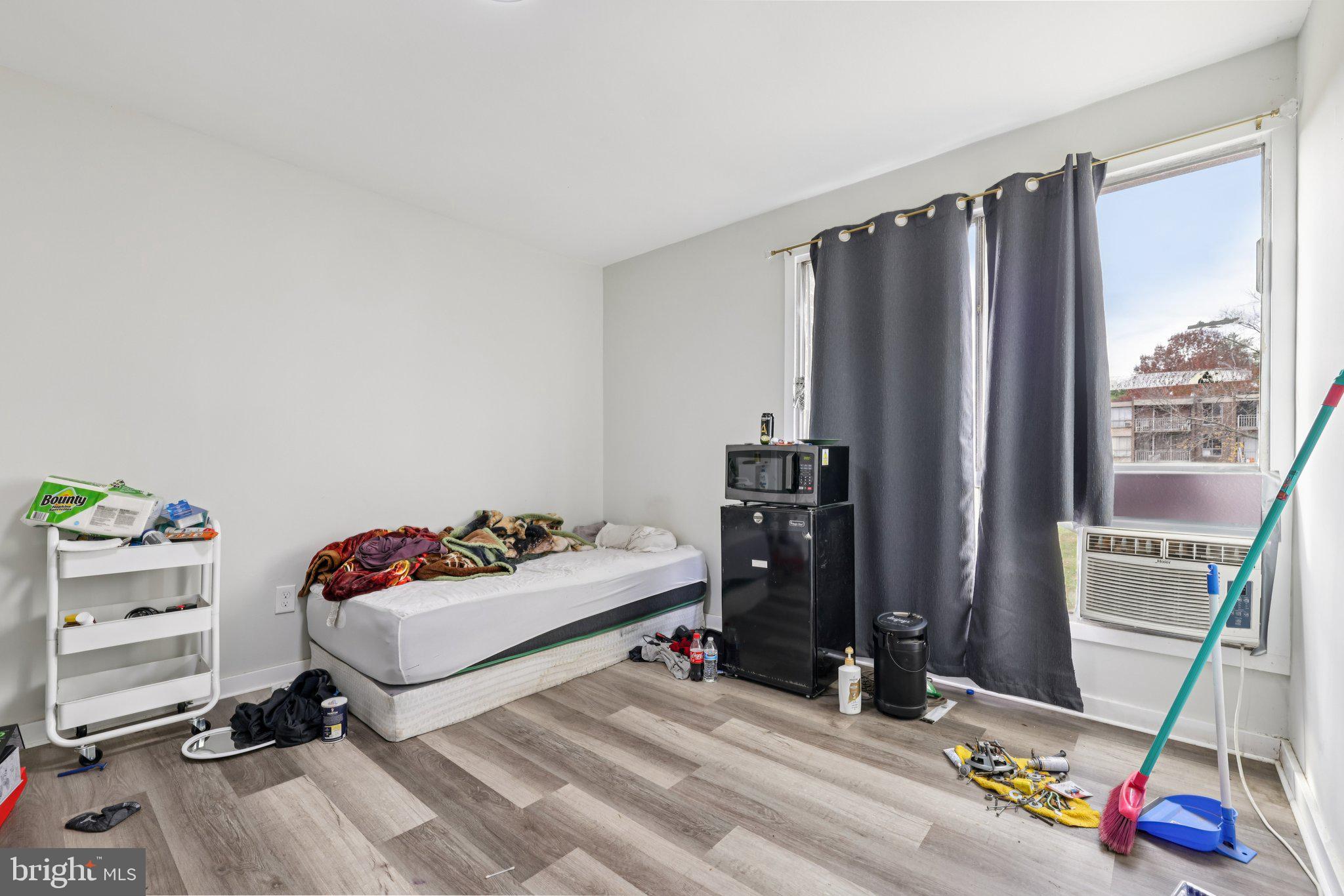 7969 Riggs Road, Unit 9 Hyattsville, MD 20783 - Photo 12 of 30 a bedroom with a bed and a window