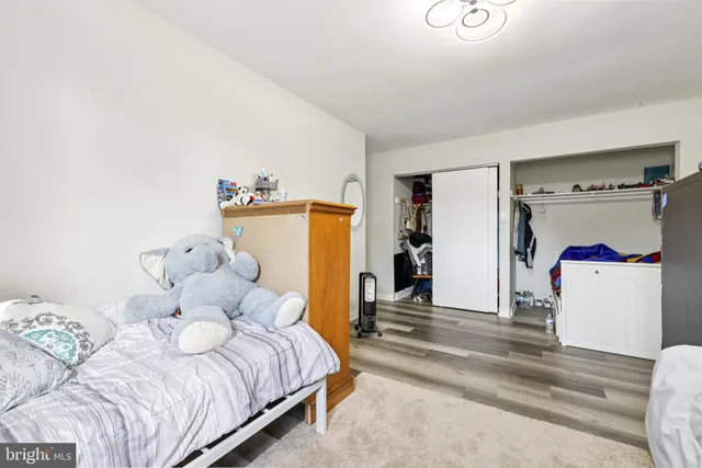 a bedroom with a bed and a tv