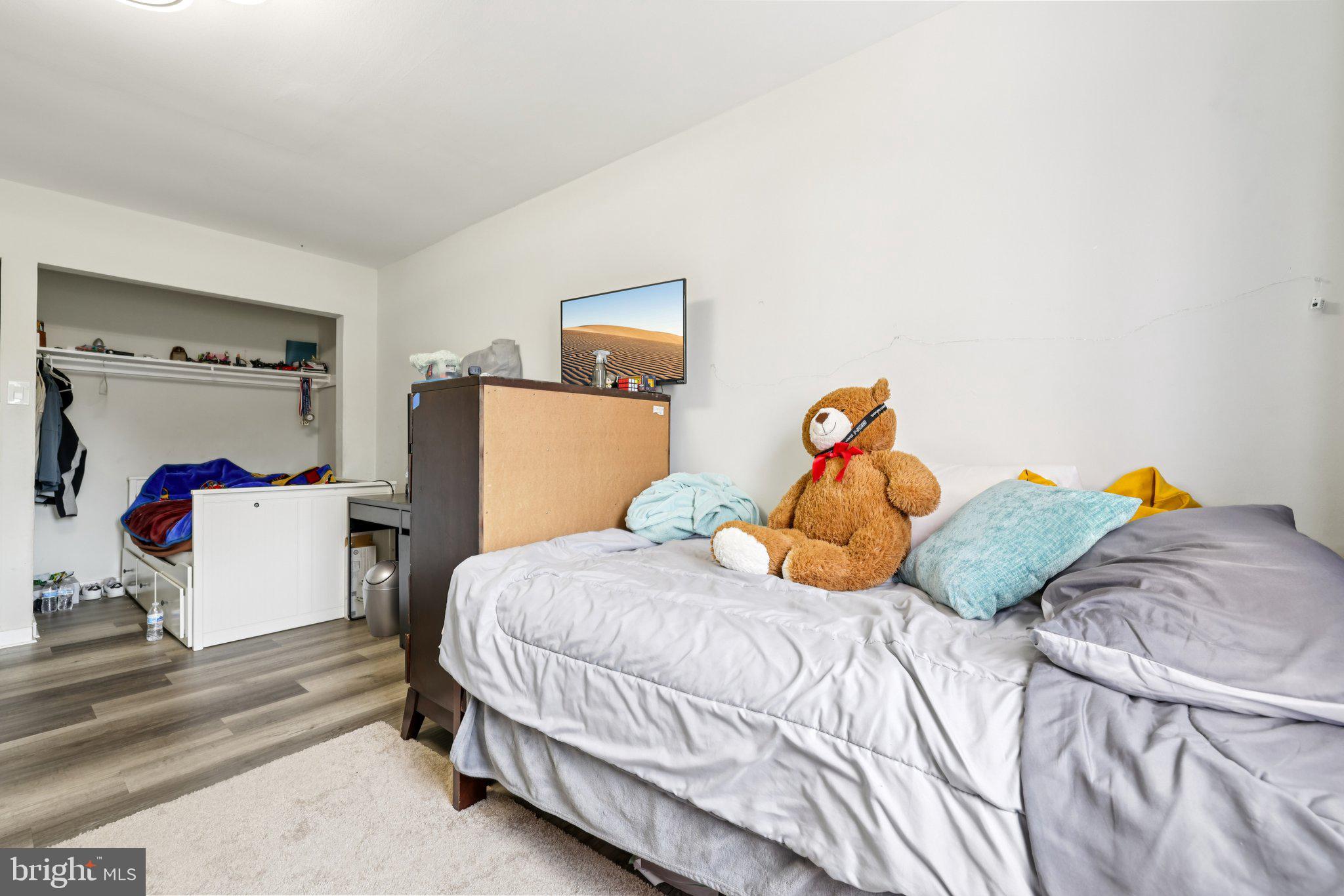 7969 Riggs Road, Unit 9 Hyattsville, MD 20783 - Photo 17 of 30 a bedroom with a bed and dresser