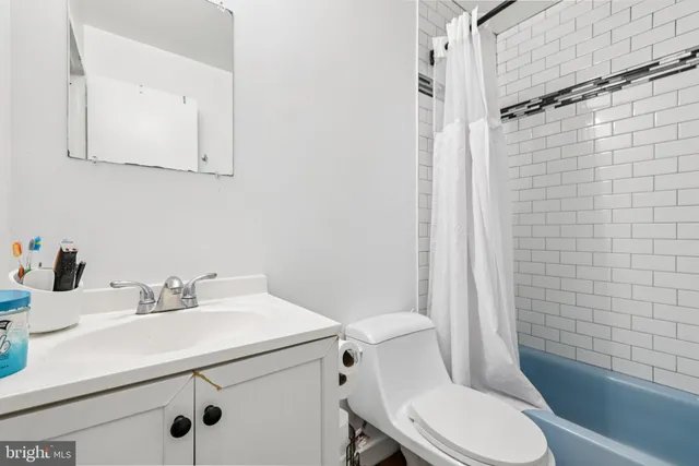 a bedroom with a bed and dresser