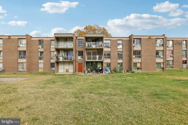 a view of a big building next to a big yard