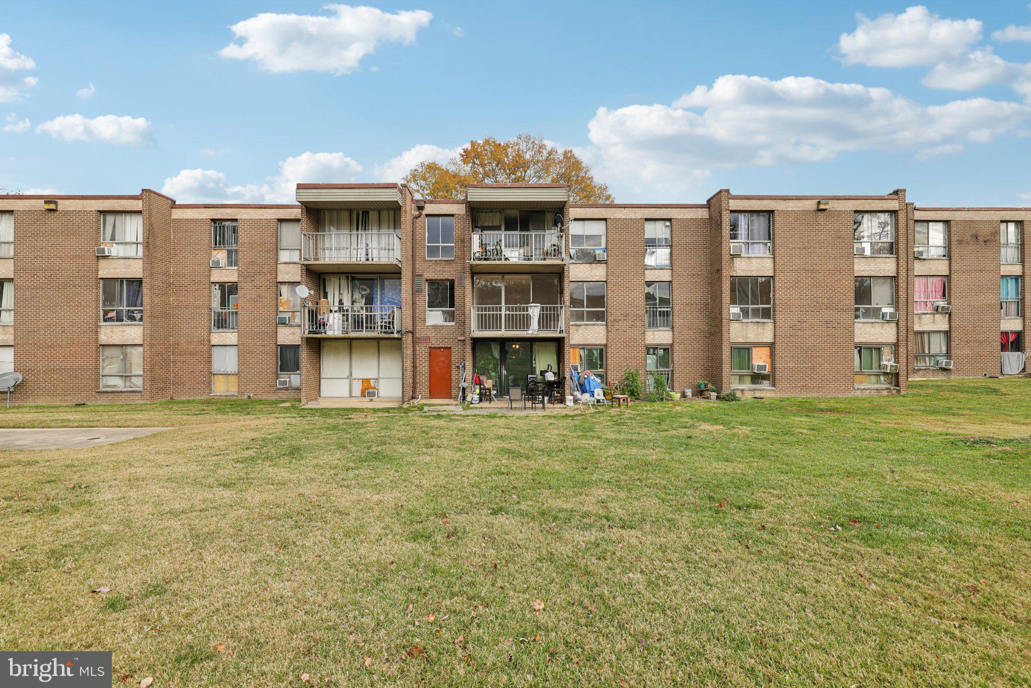 7969 Riggs Road, Unit 9 Hyattsville, MD 20783 - Photo 23 of 30 a front view of a house with a garden