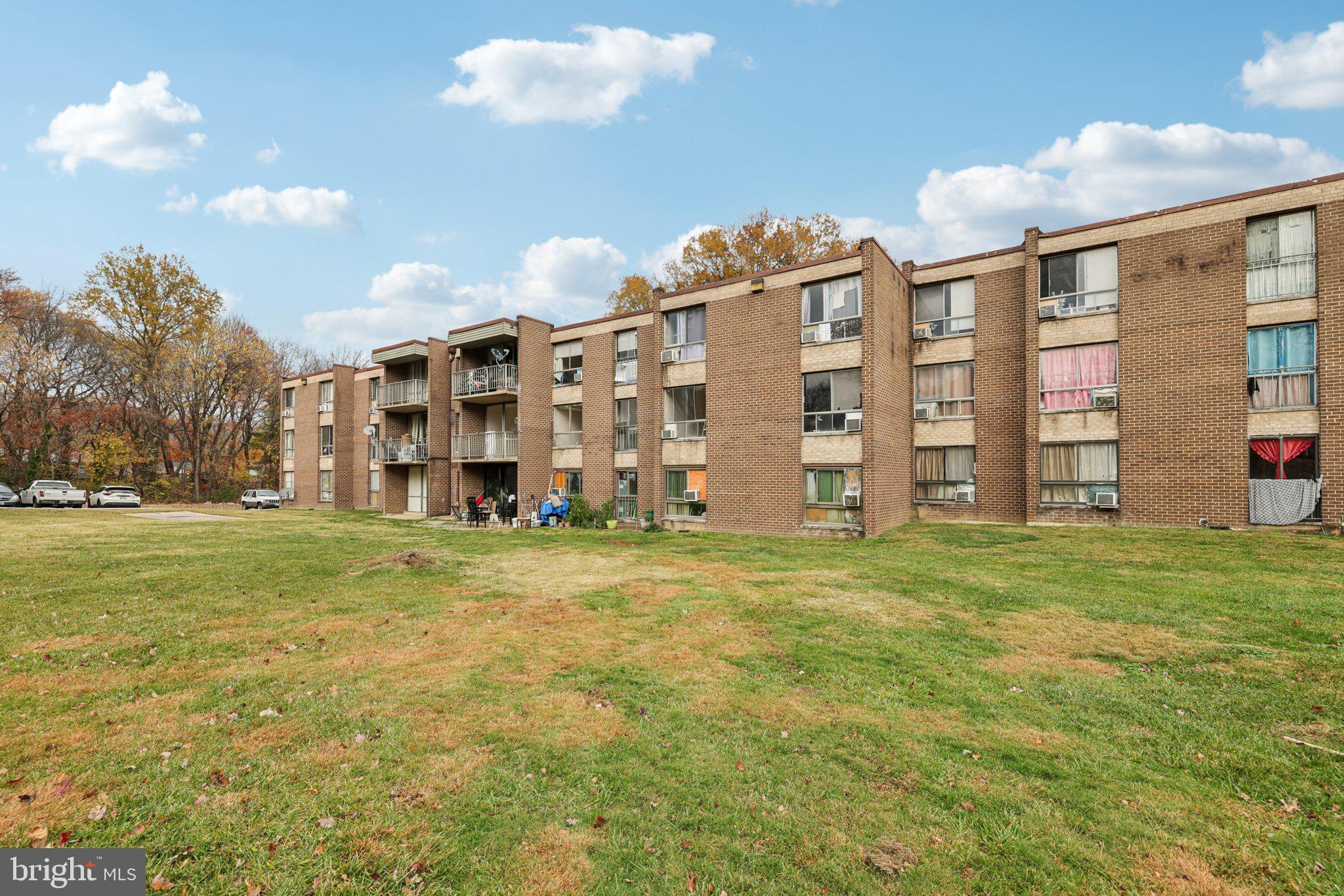 7969 Riggs Road, Unit 9 Hyattsville, MD 20783 - Photo 25 of 30 a view of a large building with a big yard