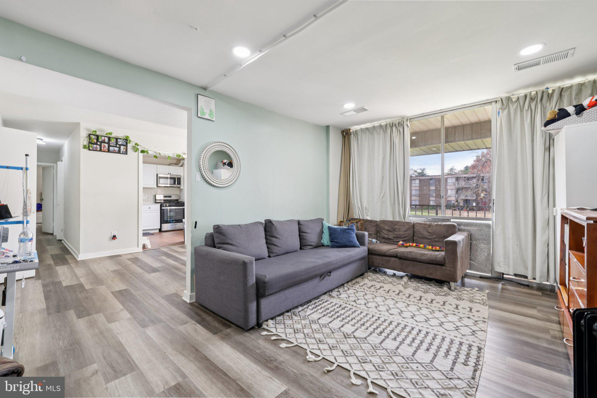 7969 Riggs Road, Unit 9 Hyattsville, MD 20783 - Photo 4 of 30 a living room with furniture and a window