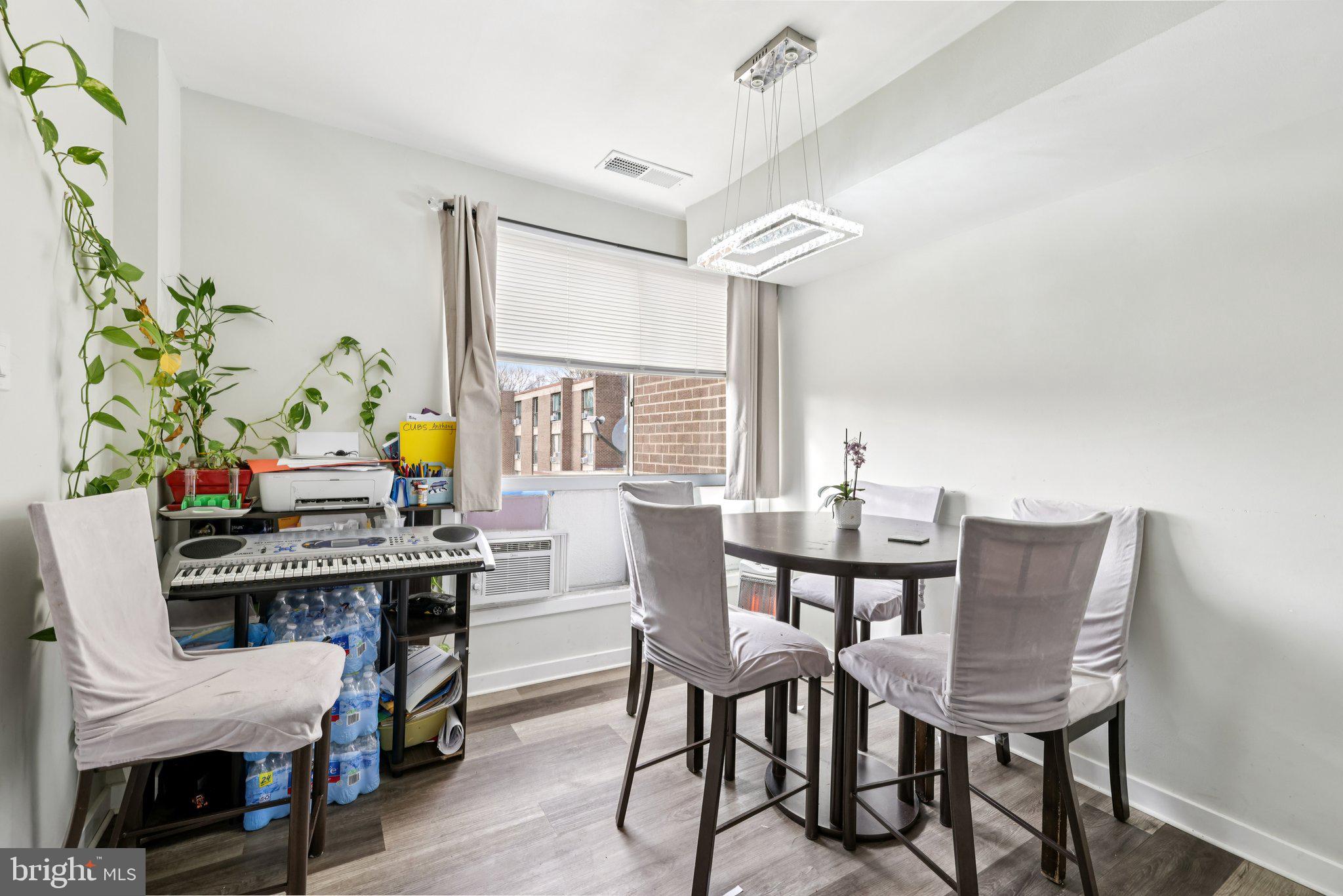 7969 Riggs Road, Unit 9 Hyattsville, MD 20783 - Photo 6 of 30 a view of a dining room with furniture