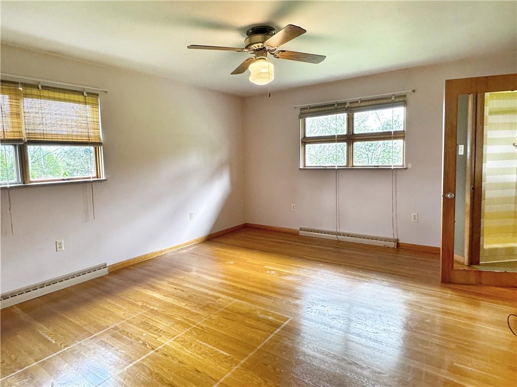 1215 Center Road Monaca, PA 15061 - Photo 18 of 33 a view of empty room with wooden floor and fan