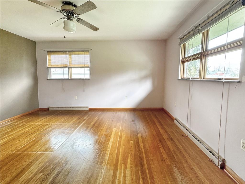 1215 Center Road Monaca, PA 15061 - Photo 19 of 33 wooden floor in an empty room with a window