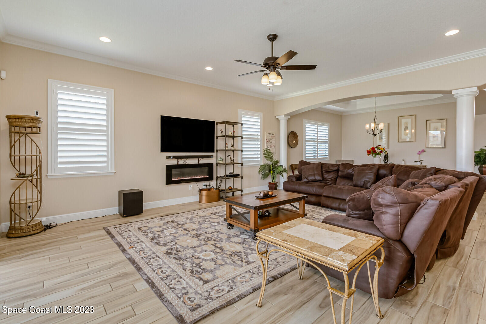 2928 Addison Drive Melbourne, FL 32940 - Photo 11 of 69 a living room with furniture a flat screen tv and a window