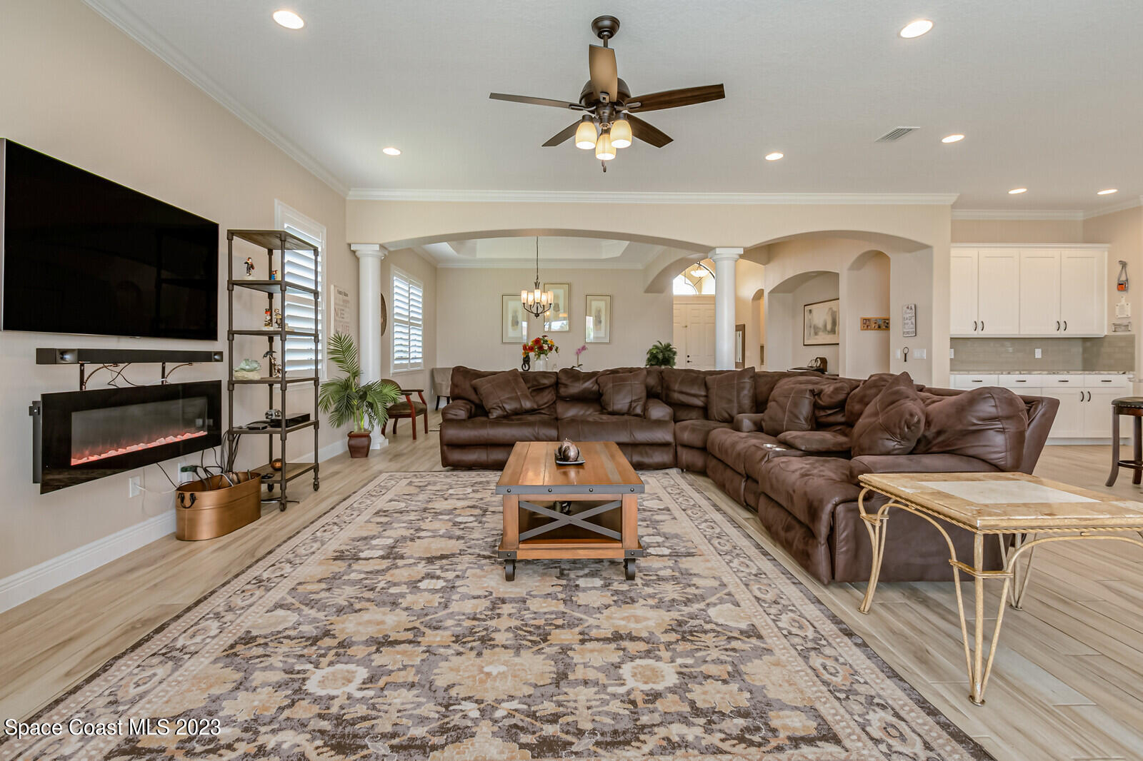 2928 Addison Drive Melbourne, FL 32940 - Photo 12 of 69 a living room with furniture and a flat screen tv
