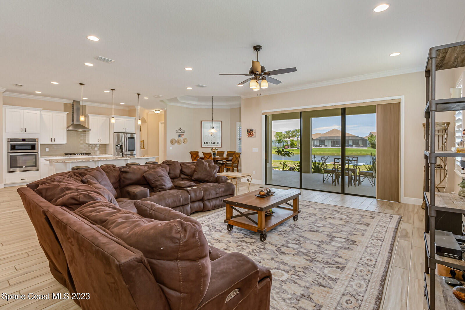 2928 Addison Drive Melbourne, FL 32940 - Photo 13 of 69 a living room with furniture and a large window