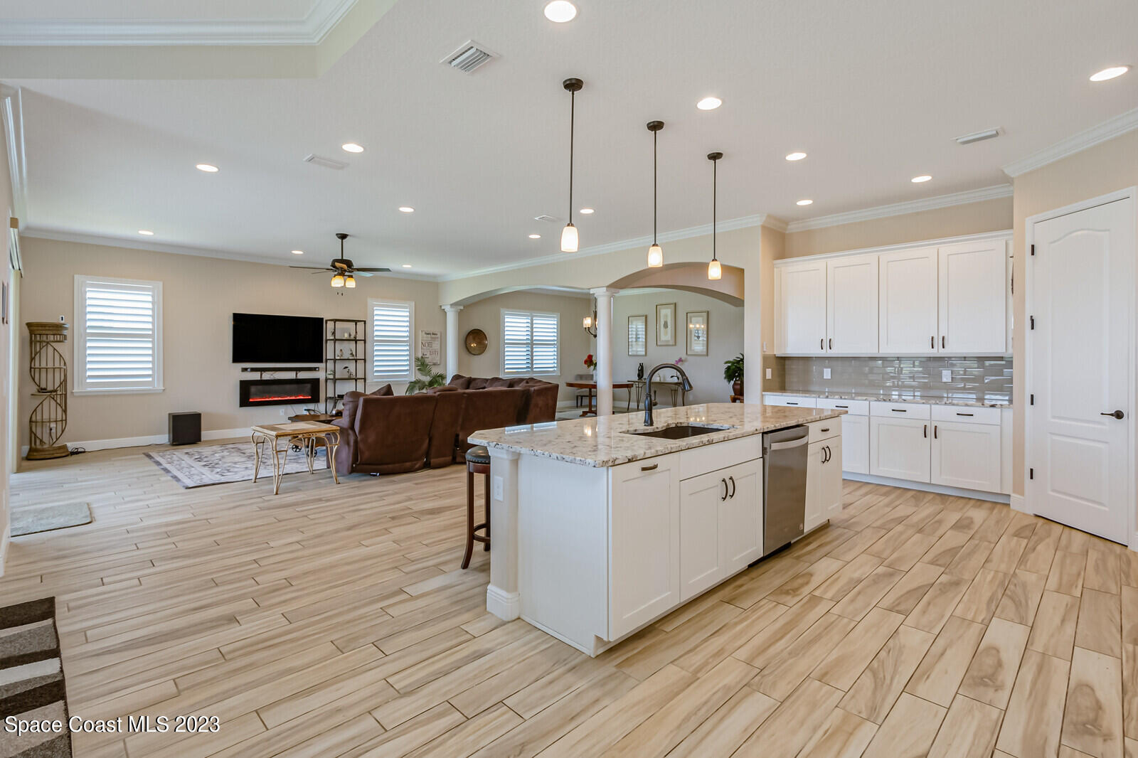 2928 Addison Drive Melbourne, FL 32940 - Photo 15 of 69 a large white kitchen with lots of counter space a sink and appliances