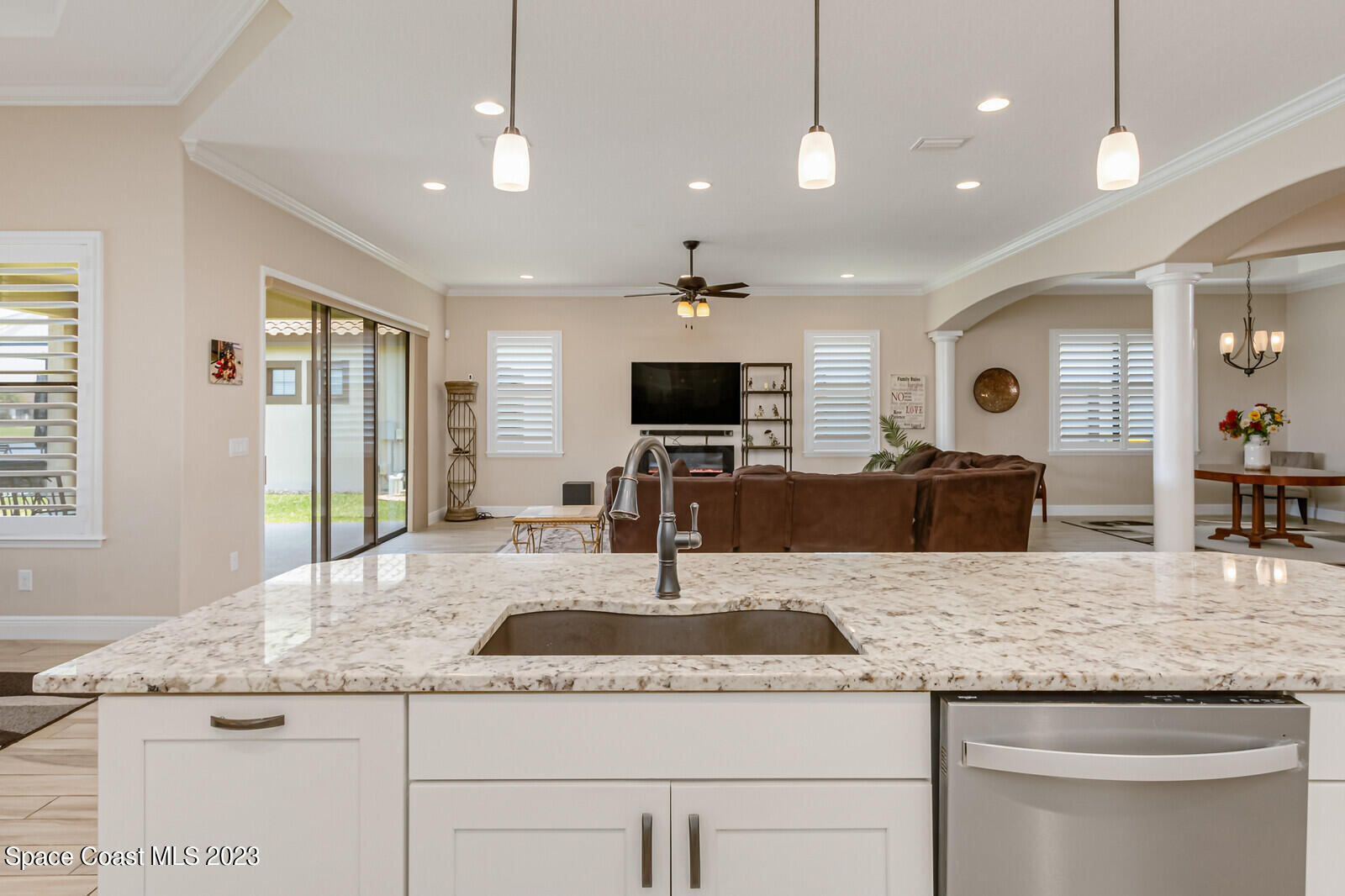 2928 Addison Drive Melbourne, FL 32940 - Photo 19 of 69 a kitchen with granite countertop kitchen island sink and center island