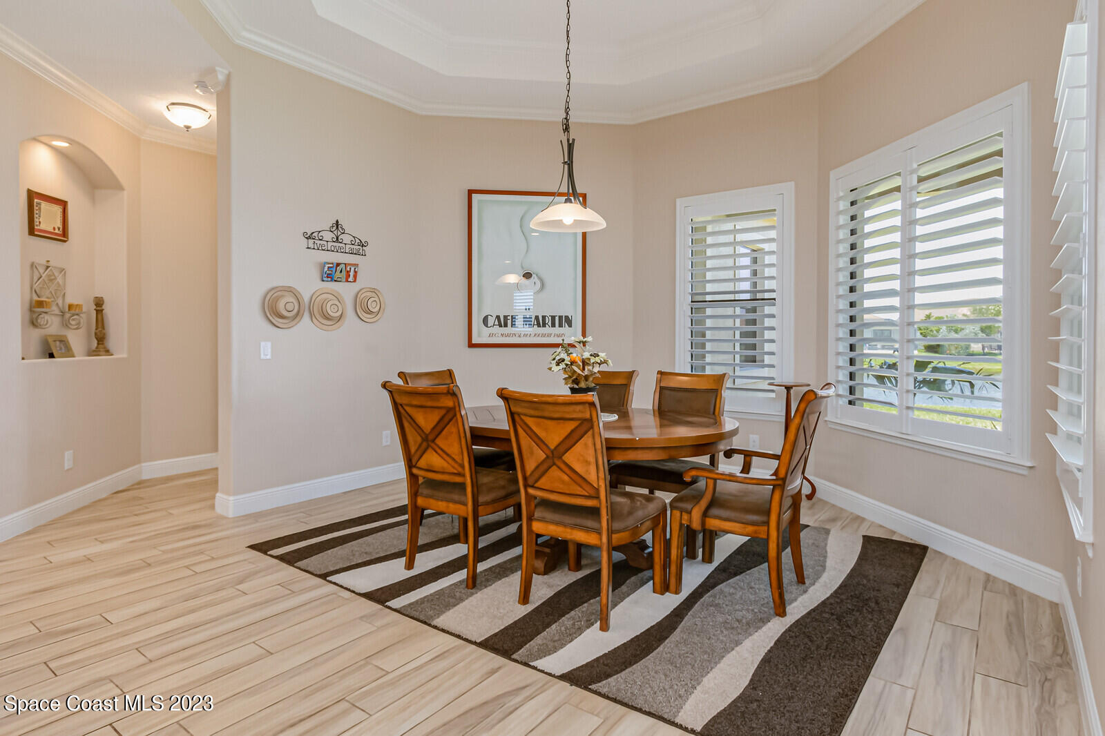 2928 Addison Drive Melbourne, FL 32940 - Photo 21 of 69 a view of a dining room with furniture window and wooden floor