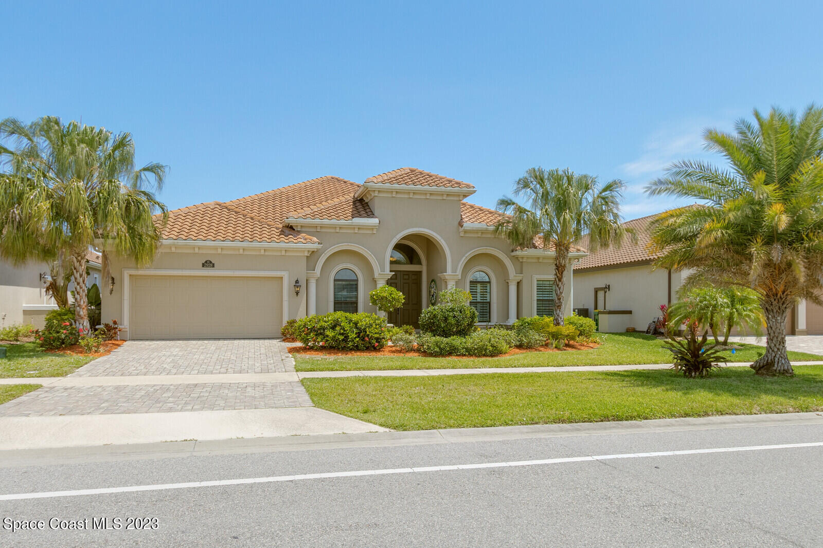 2928 Addison Drive Melbourne, FL 32940 - Photo 3 of 69 a front view of a house with a yard