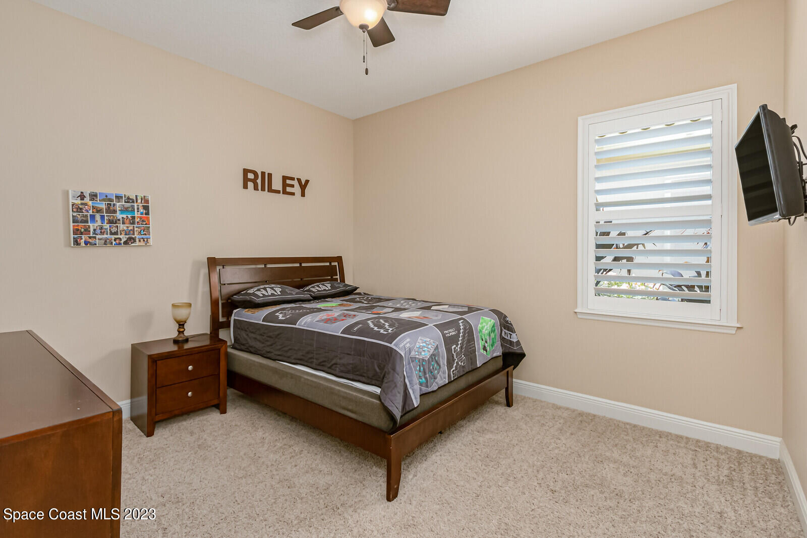 2928 Addison Drive Melbourne, FL 32940 - Photo 33 of 69 a bedroom with a bed and a window