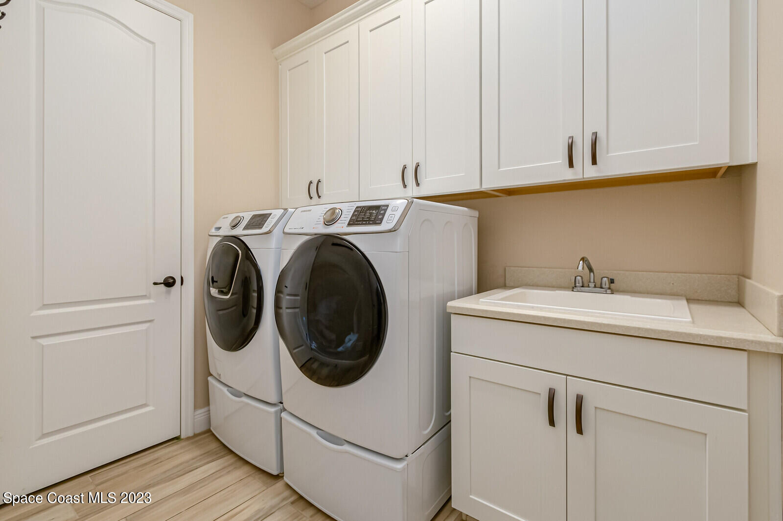 2928 Addison Drive Melbourne, FL 32940 - Photo 34 of 69 a utility room with dryer and washer