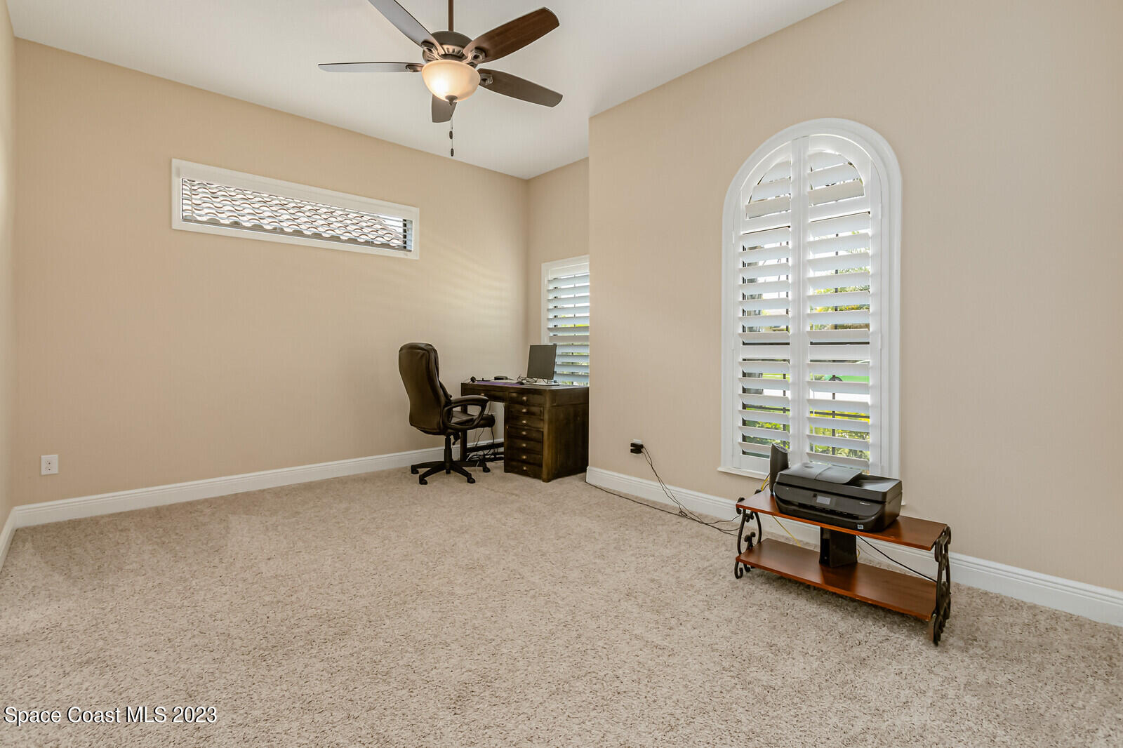 2928 Addison Drive Melbourne, FL 32940 - Photo 36 of 69 a room with gym equipment and a window