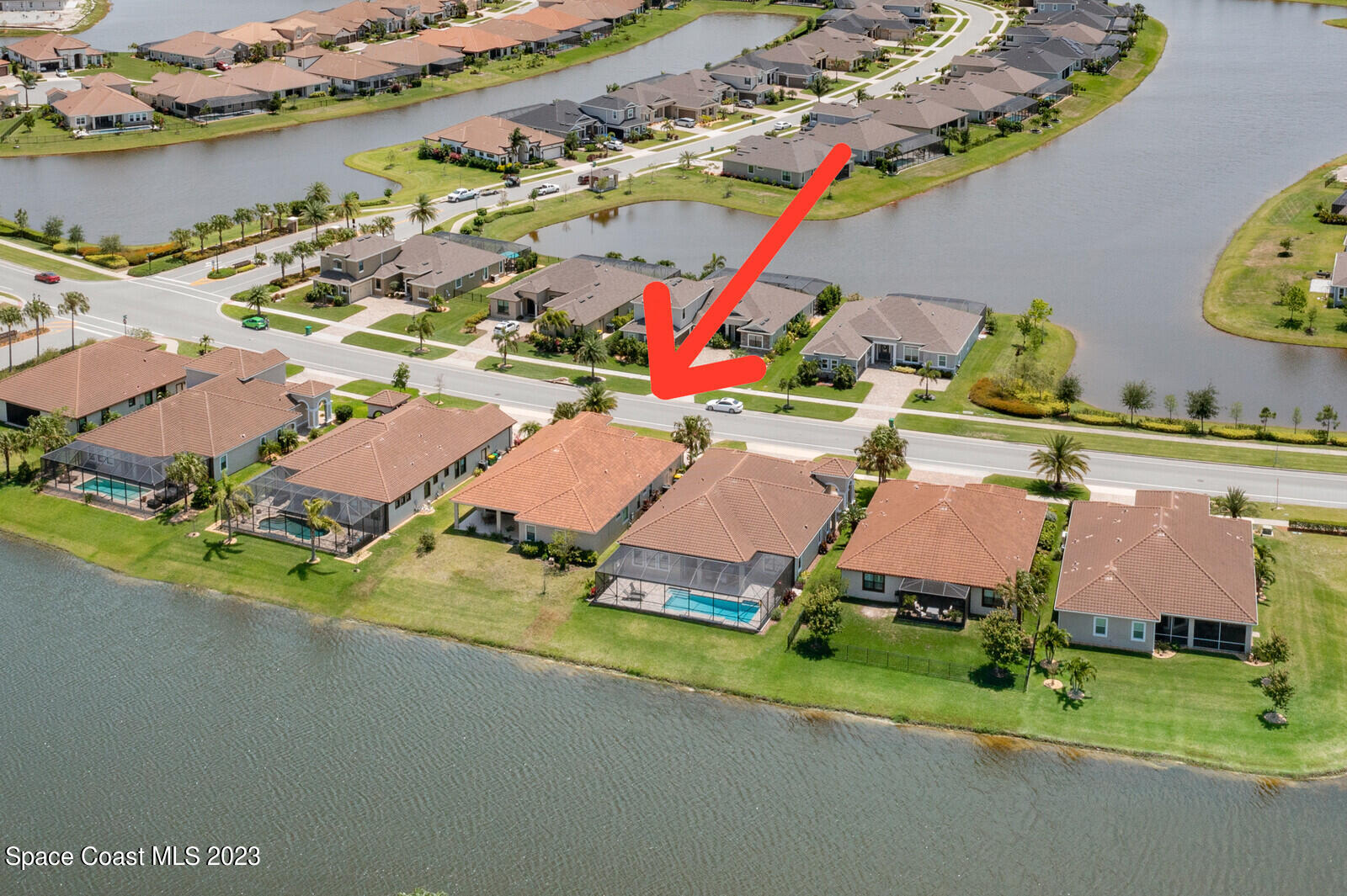 2928 Addison Drive Melbourne, FL 32940 - Photo 49 of 69 an aerial view of a house with a garden and lake view