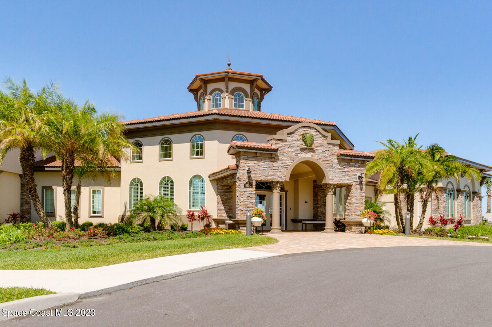 2928 Addison Drive Melbourne, FL 32940 - Photo 56 of 69 a front view of a house with a yard and garage