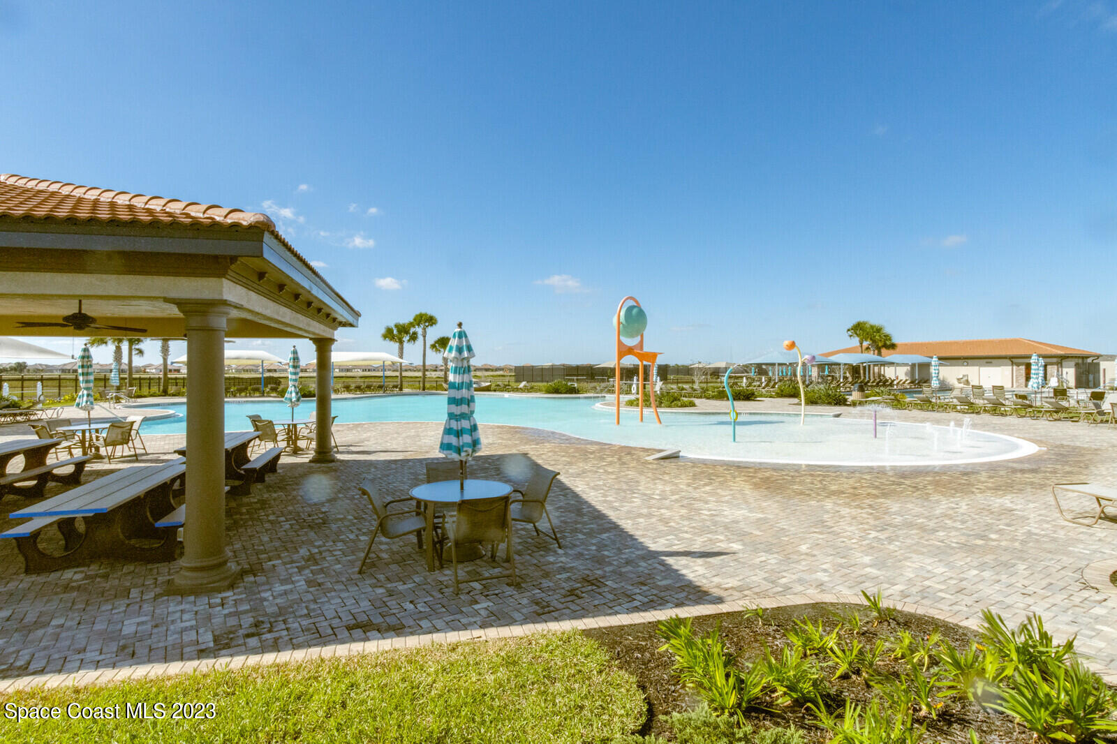 2928 Addison Drive Melbourne, FL 32940 - Photo 63 of 69 a view of a swimming pool with a patio