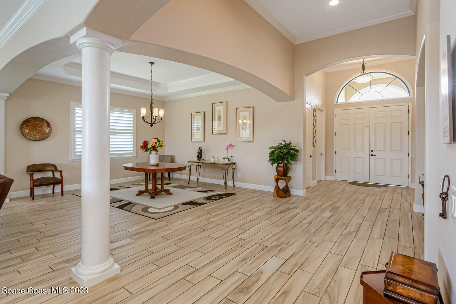 2928 Addison Drive Melbourne, FL 32940 - Photo 7 of 69 a living room with furniture and wooden floor
