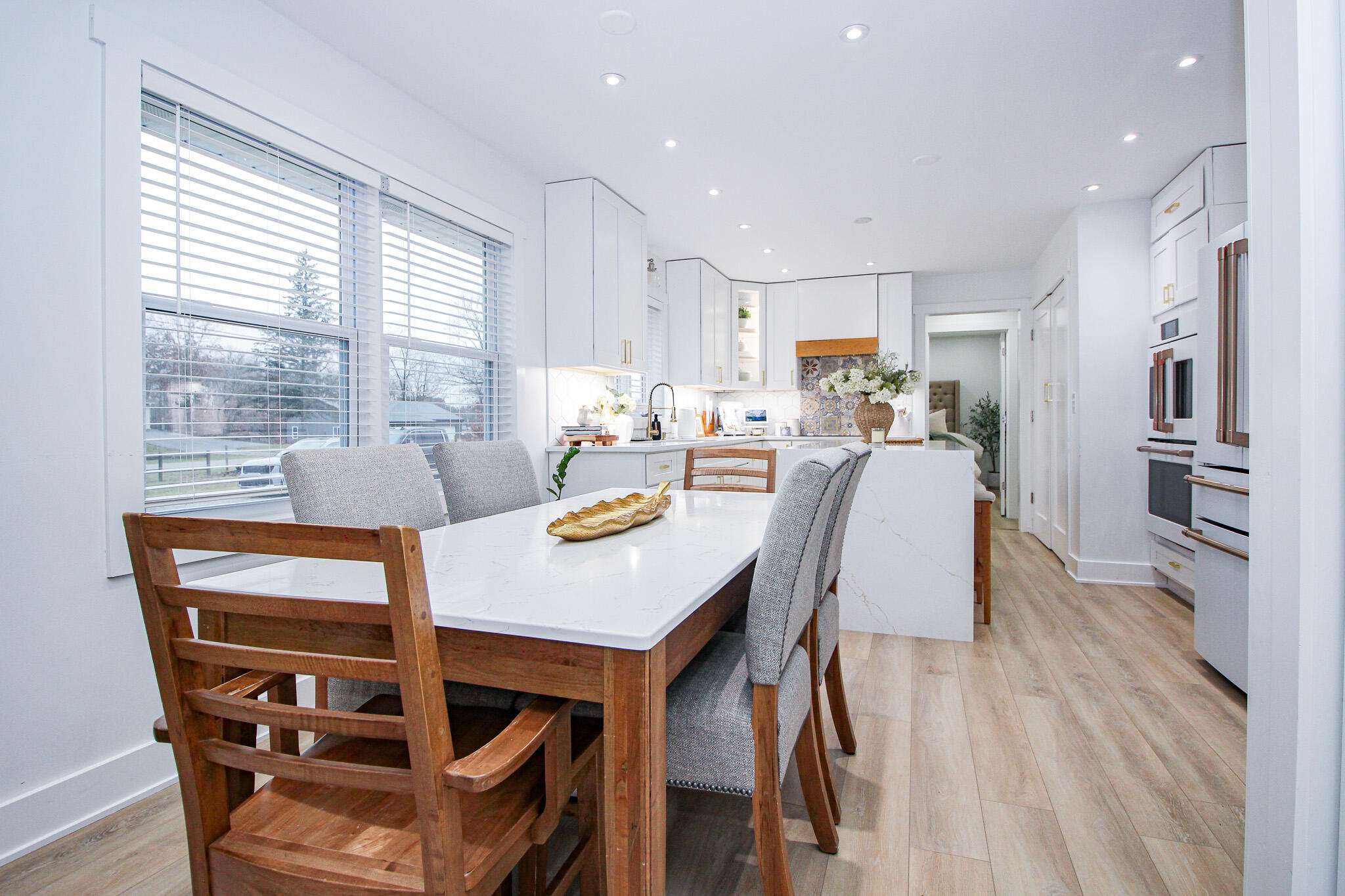 10791 North 1000 West Demotte, IN 46310 - Photo 11 of 55 a view of a dining room with furniture window and wooden floor
