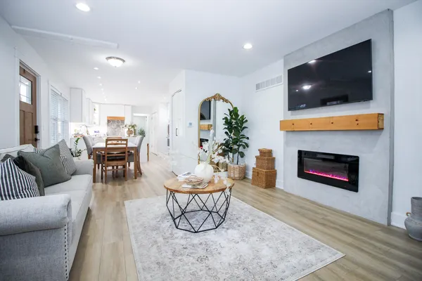 a living room with furniture and a fireplace
