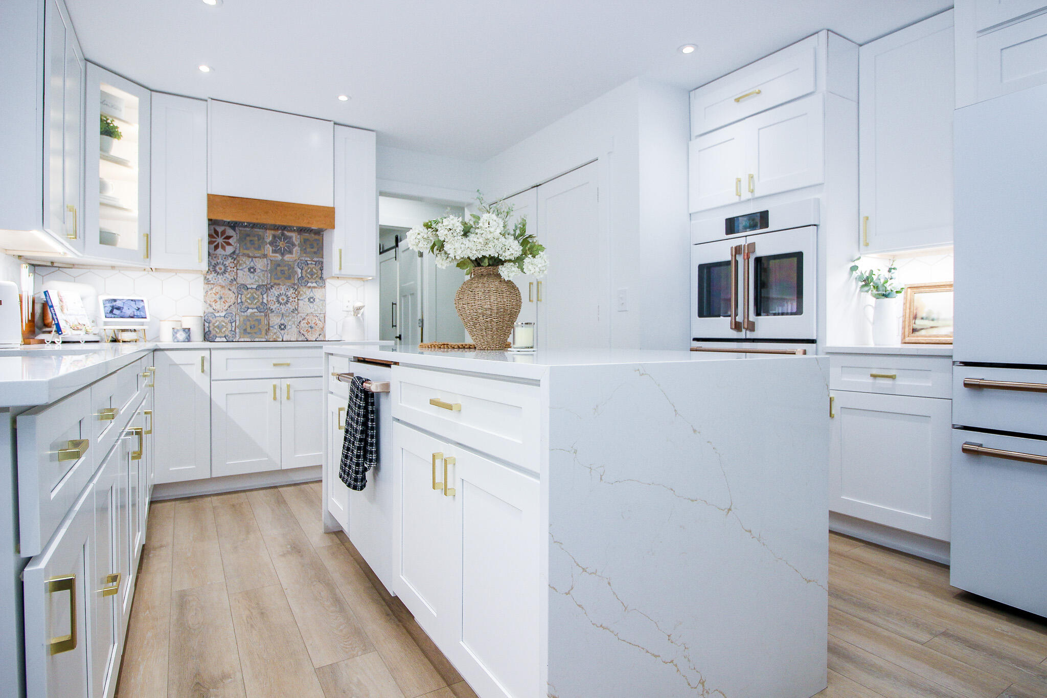 10791 North 1000 West Demotte, IN 46310 - Photo 3 of 55 a kitchen with a sink stove cabinets and wooden floor