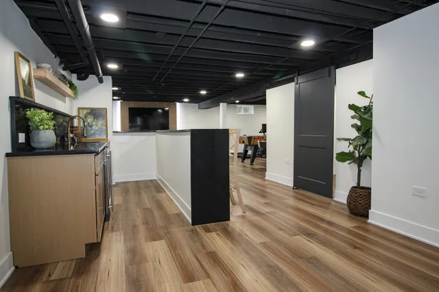 a kitchen with refrigerator and window