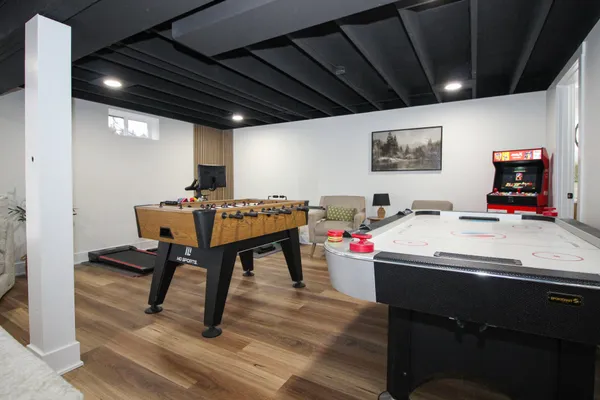 a bathroom with a shower a toilet and a sink