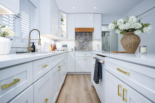 a kitchen with kitchen island granite countertop lots of counter top space and stainless steel appliances