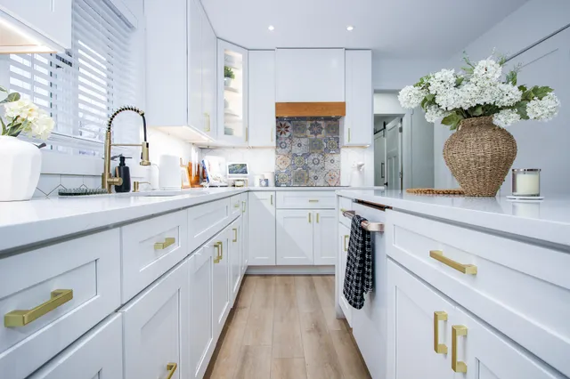 a kitchen with kitchen island granite countertop lots of counter top space and stainless steel appliances