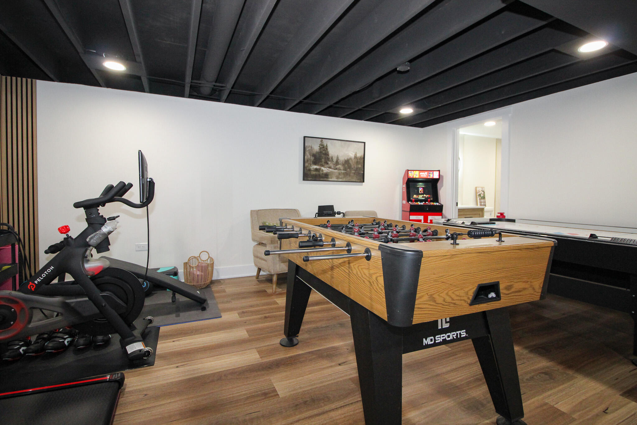 10791 North 1000 West Demotte, IN 46310 - Photo 41 of 55 a room with table tennis gym equipment and view of living room