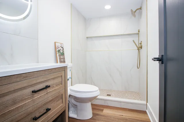 a view of house with yard and trees in the background