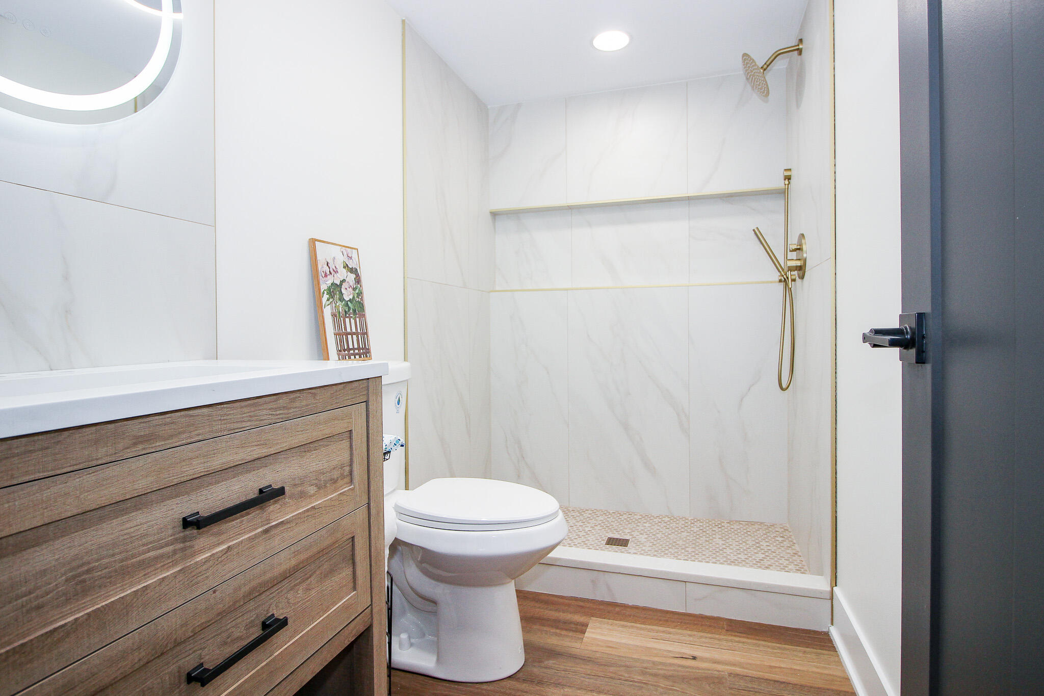 10791 North 1000 West Demotte, IN 46310 - Photo 43 of 55 a bathroom with a shower a toilet and a sink