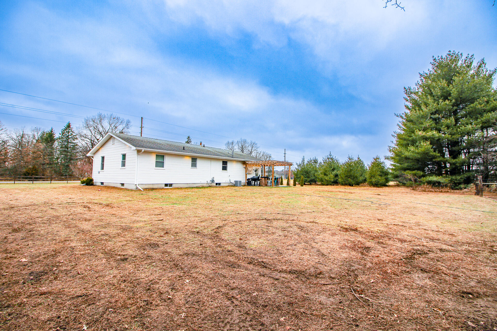 10791 North 1000 West Demotte, IN 46310 - Photo 48 of 55 a view of house with yard and trees in the background
