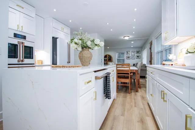 a kitchen with stainless steel appliances a sink and cabinets