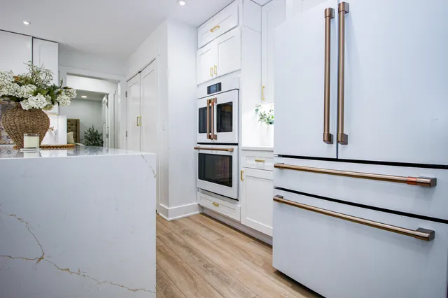 a dining room with furniture and wooden floor