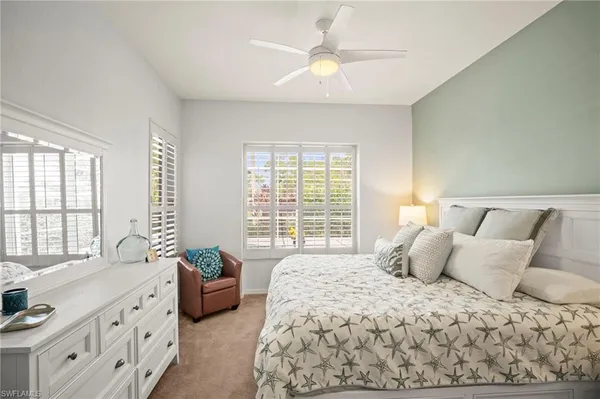 a bedroom with a large bed and a couch