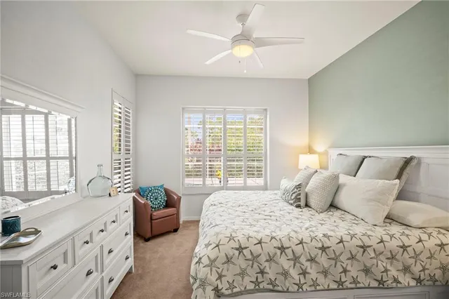 a bedroom with a large bed and a couch