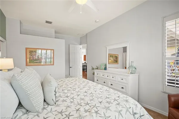 a bedroom with a bed and a dresser